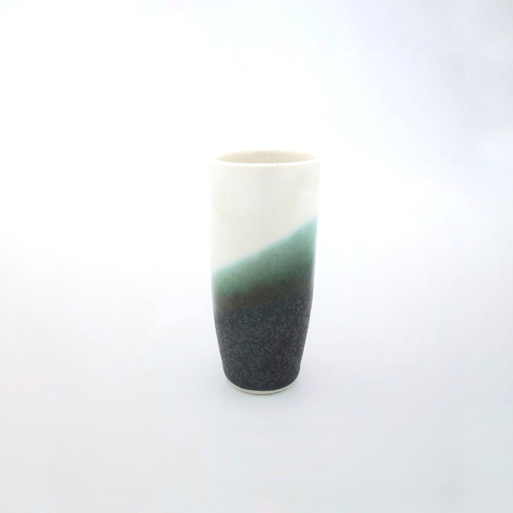 Kaolin - Iceramic. The Pole is a shotglas made of porcelain. It comes in many colors where the glaze is inspired by the icelandic nature, lava fields and moss, black beaches and melting icebergs.