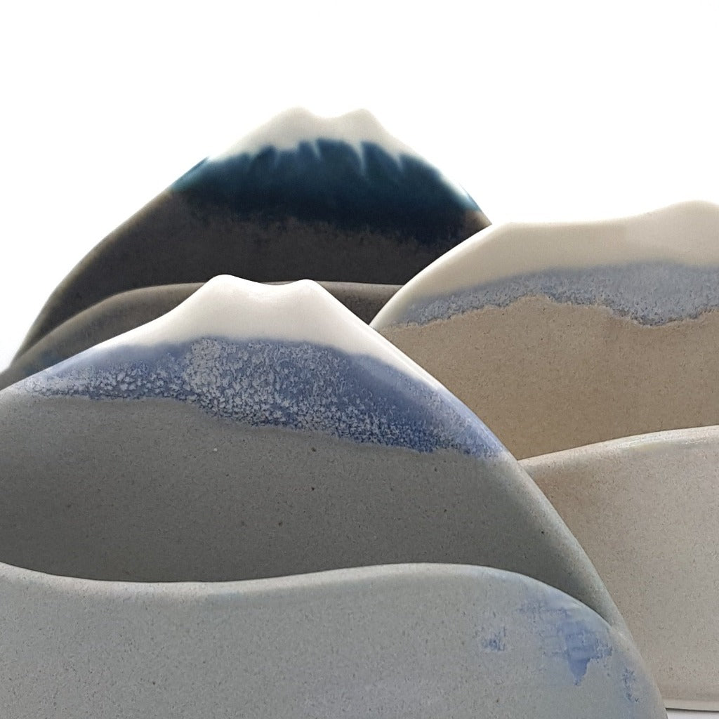 Kaolin - Iceramic - My special mountain. handbuilt porcelain tealight in the form of a special mountain, two of our most famous glaciers Snæfellsjökull and Eyjafjallajökull. When lit up they remind us of how fast these glaciertops are changing due to global warming.