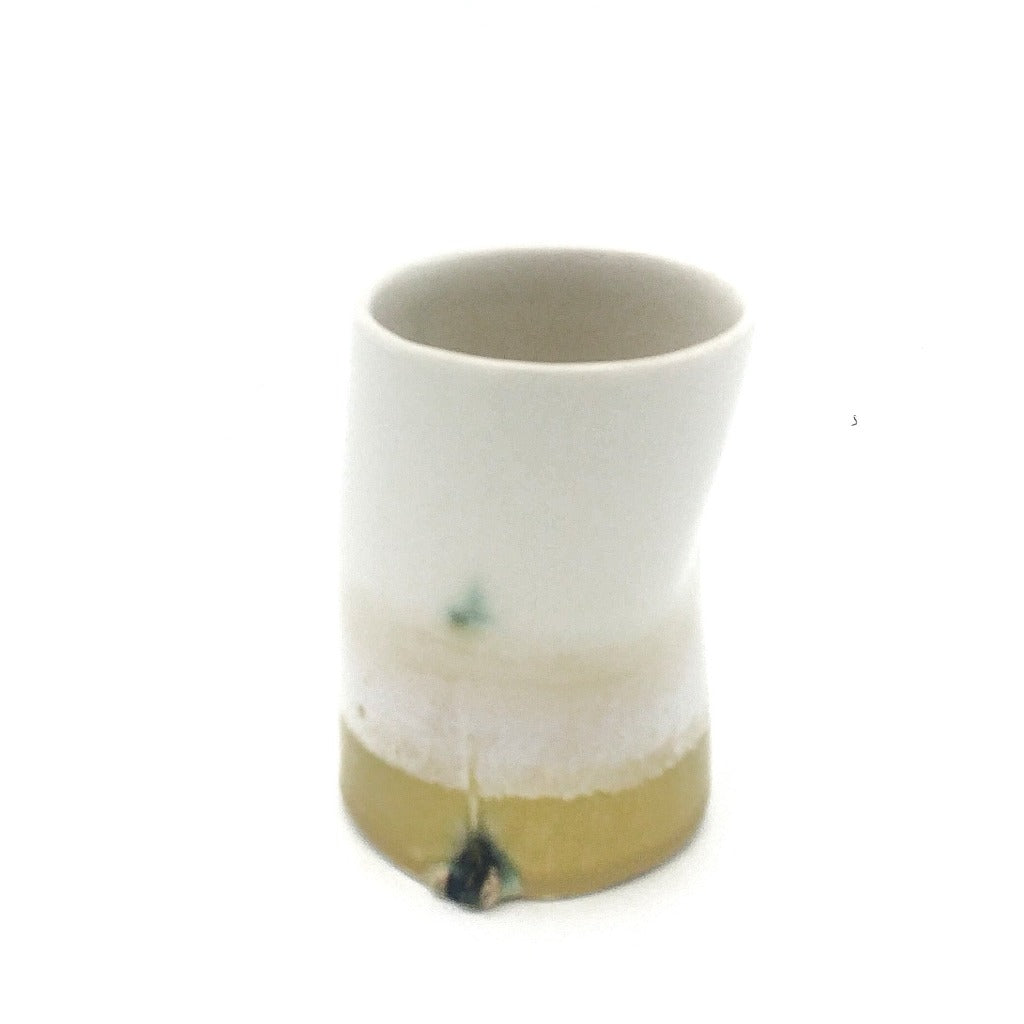 Kaolin-gudnyhaf-porcelain coffiecup/glass. Color white and yellow.